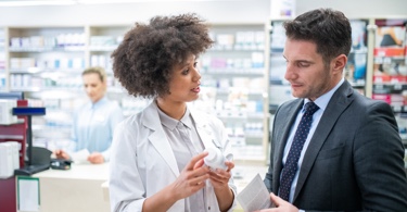 Photo of a pharmacist giving advice to a client