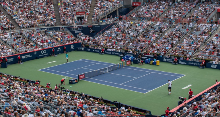 Photo of a tennis stadium filled with fans