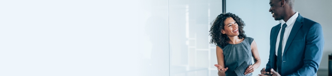 A man and woman discussing things in an office