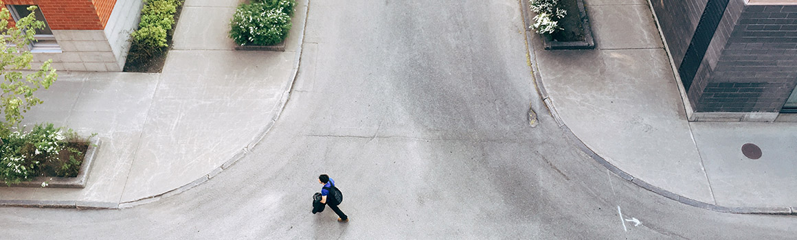 Picture of someone walking in the street.