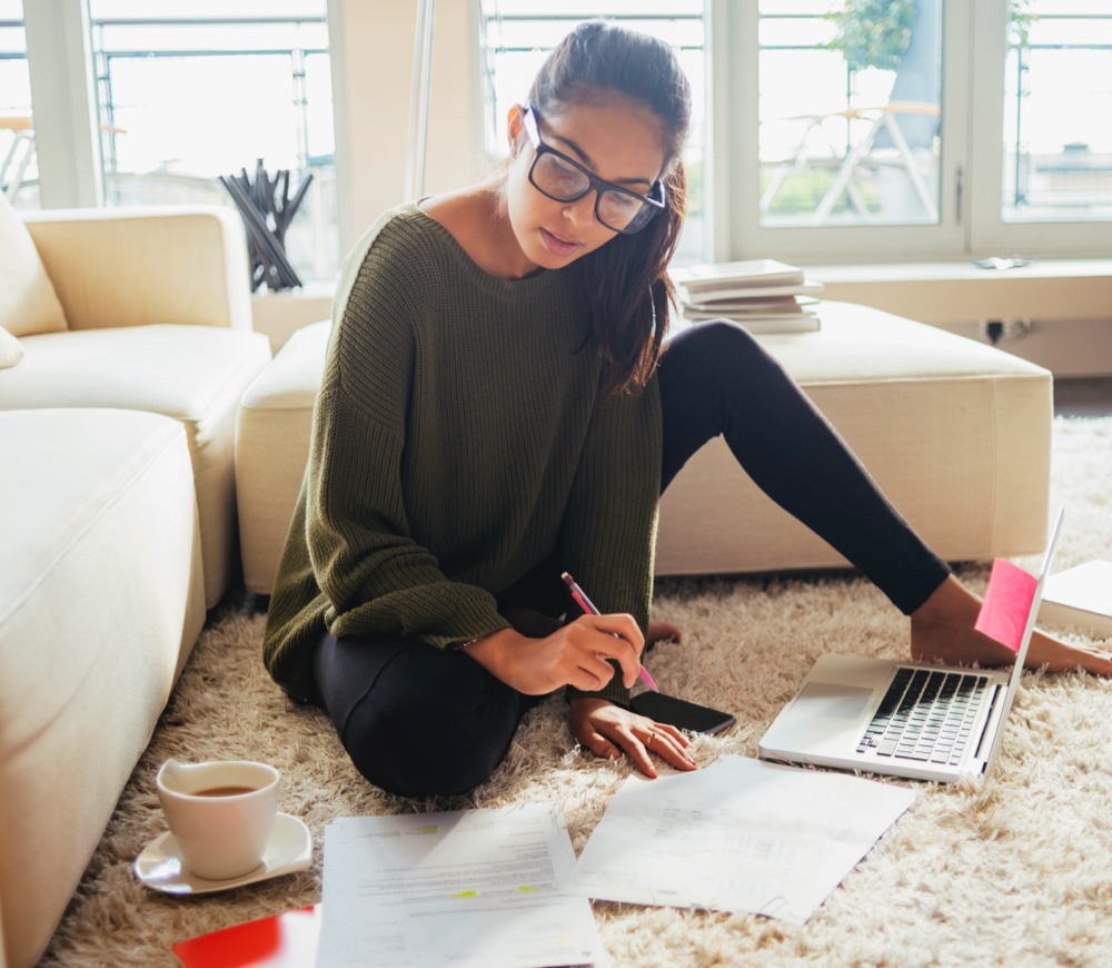 Photo of a woman working on her living-room carpet