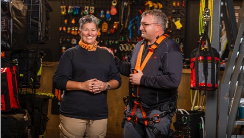 Photo of a National Bank advisor and their client speaking in a health and safety equipment store 