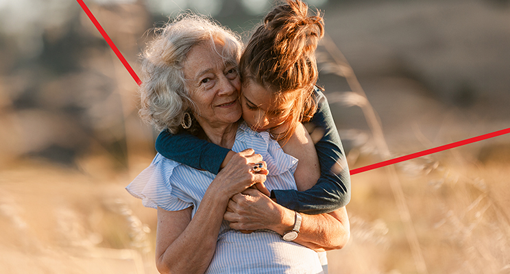 Photo of a granddaughter hugging her grandmother representing National Bank's wealth management and succession planning services