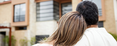 Couple looking at their house