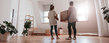 Couple standing in their new appartment