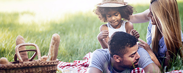 Young family having a picnic