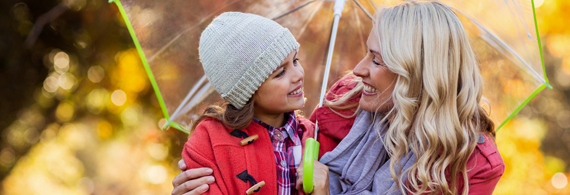 Woman and little girl smiling at each other