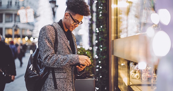Man in front of a shop