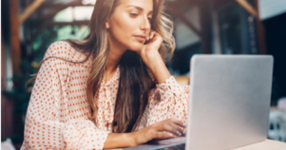 Young woman works at her computer