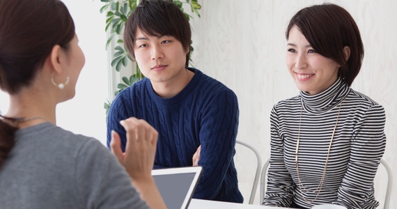 Young couple talking with a banking advisor