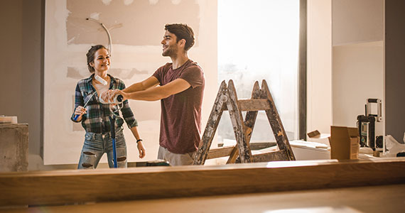 Young couple doing home renovations