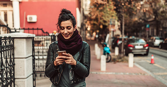 Women walking with her mobile