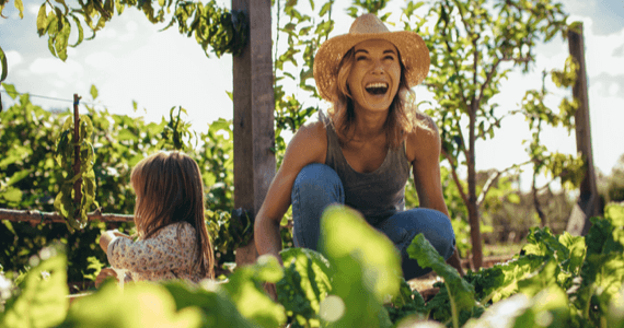 A mother with her daughter in the garden