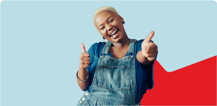 Photo of a woman smiling and wearing overalls and a blue shirt 