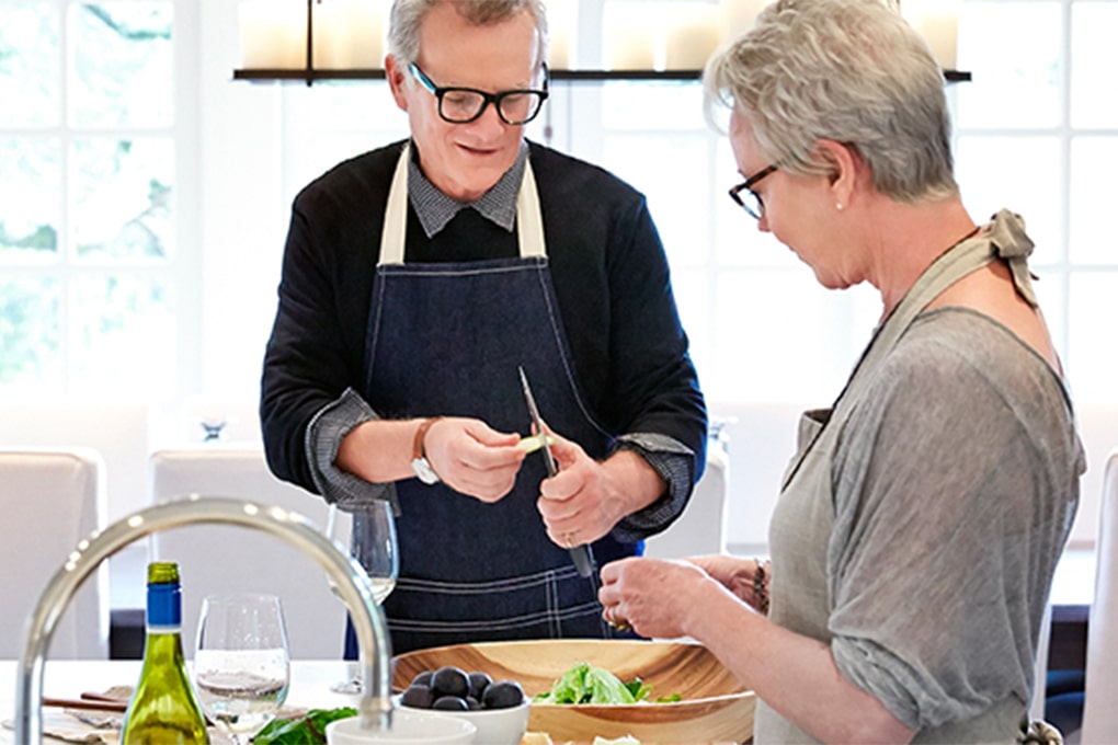 Photo of a retired couple cooking