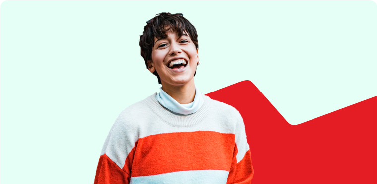 Photo of a woman smiling and wearing a red and blue shirt