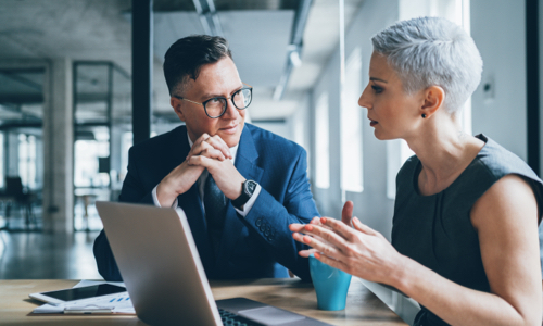 Two business professionals having a conversation