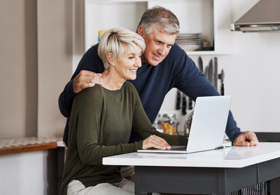 Couple watching his laptop
