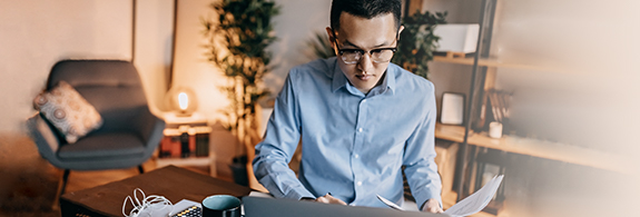 Young man looking at a computer