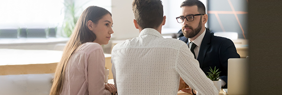 Couple talking with an advisor