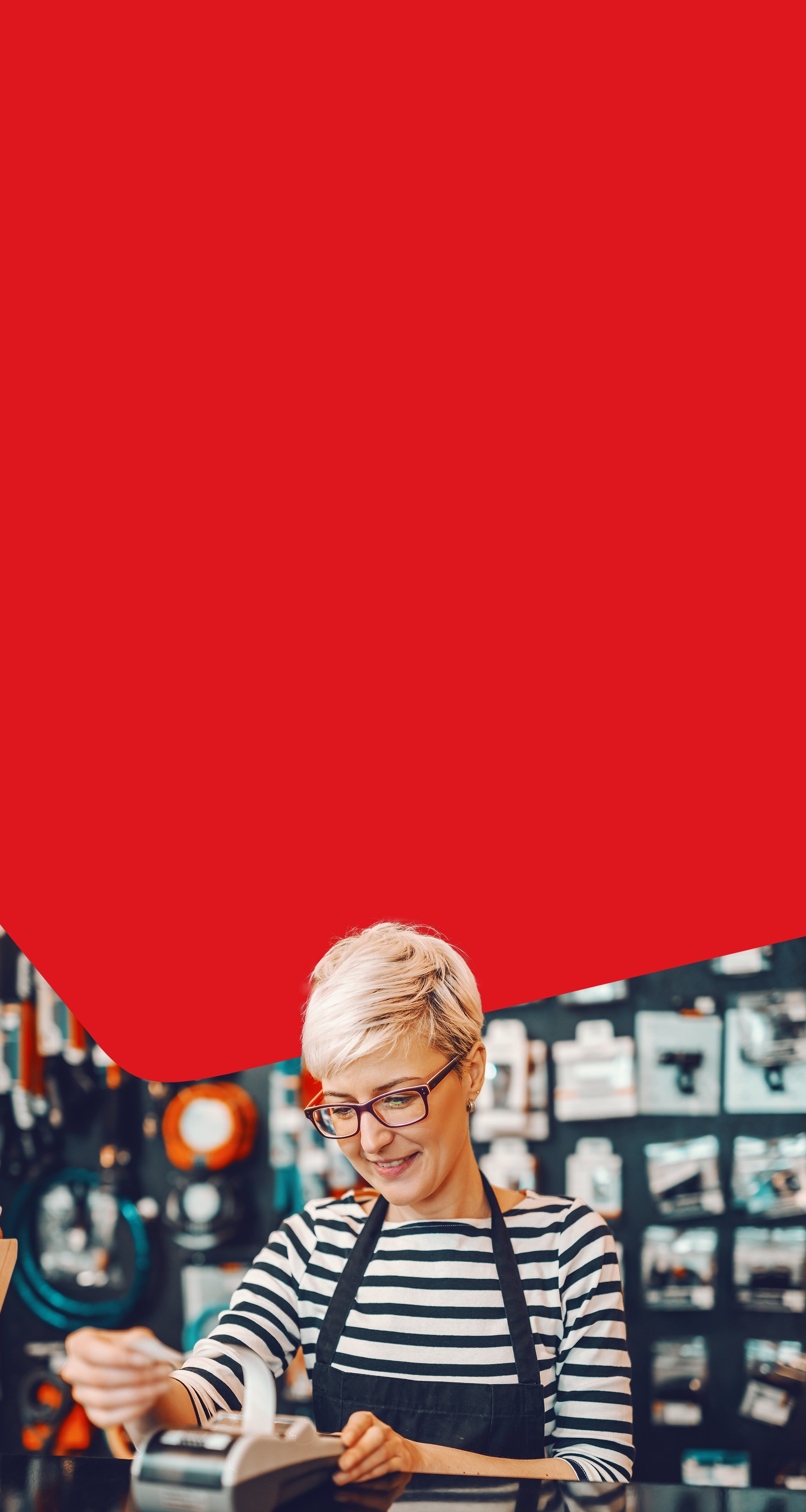 Photo of an entrepreneur managing their cash flow at the counter of her store