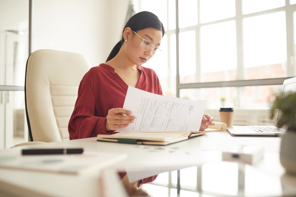 Photo of a woman reading her notes