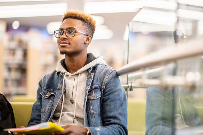 Photo of a student sitting down for an article about student loans in Canada