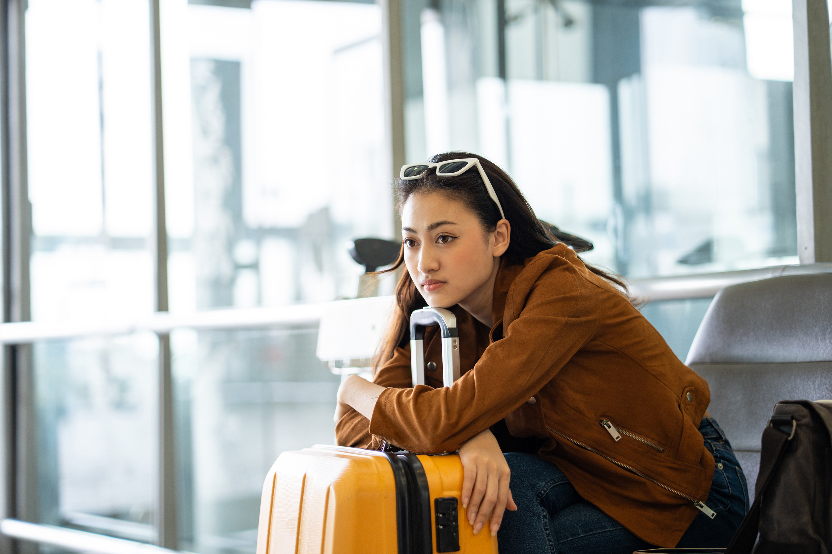 Photo of a woman smiling thanks to National Bank’s comprehensive travel insurance. 