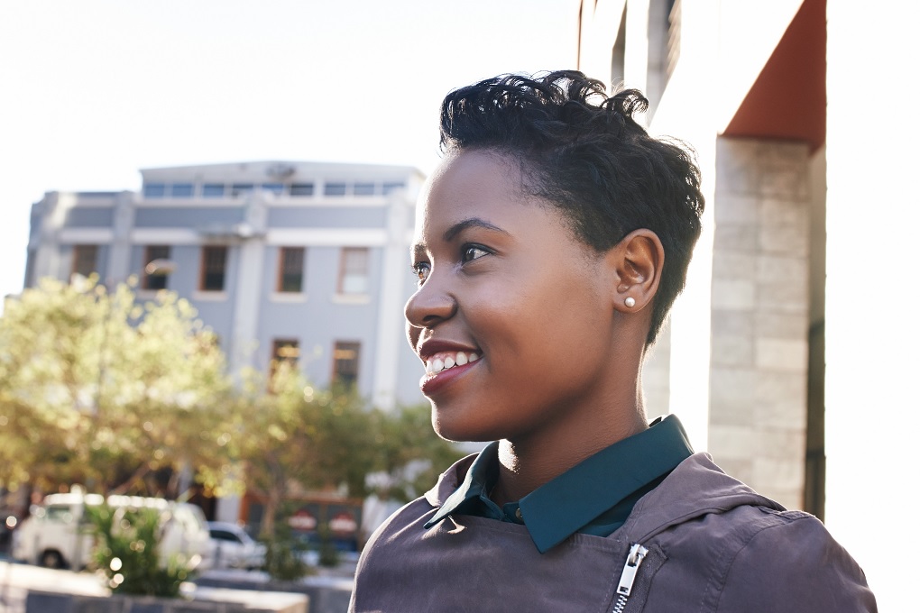 Woman outside dreaming of financial independence