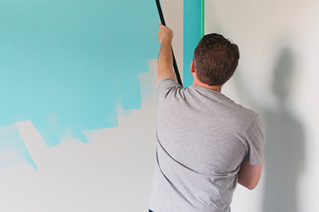 Man painting from behind 