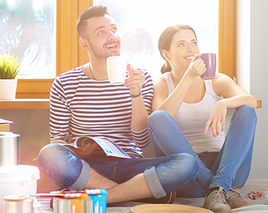 Portrait of young couple moving in new home