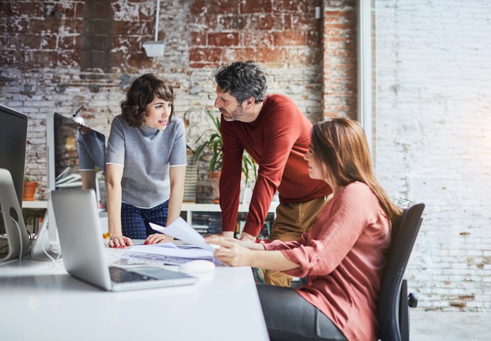 Entrepreneurs chatting during a meeting about recession.