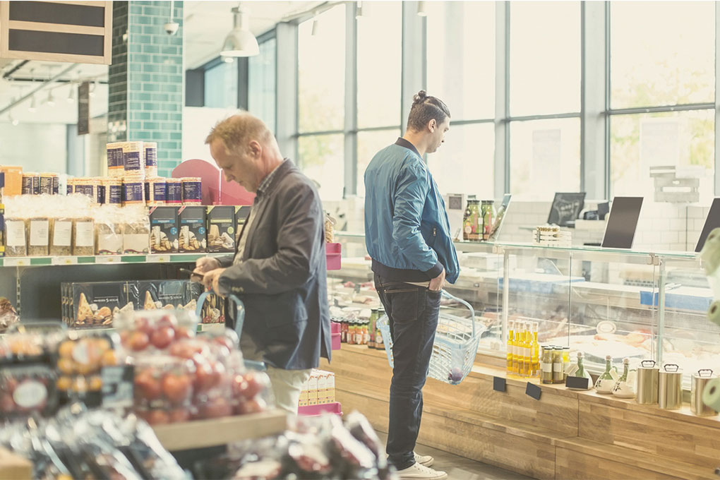 men in a grocery store