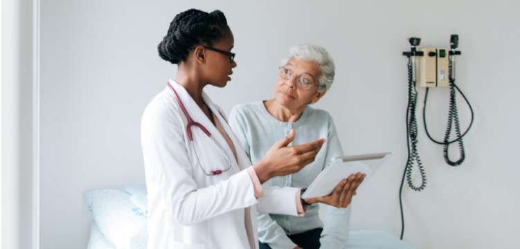 Photo of two people at a doctor’s office 