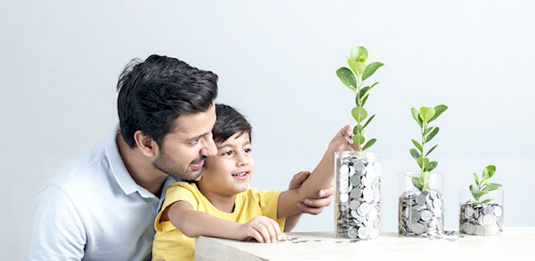 Photo of a man and his son looking at transparent vases filled with coins and sprouting flowers, representing our offer for newcomers 