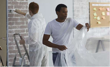 Photo of two people working