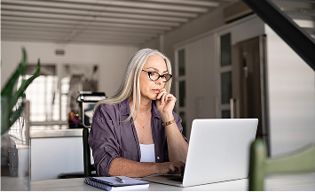Photo of a person in front of a computer