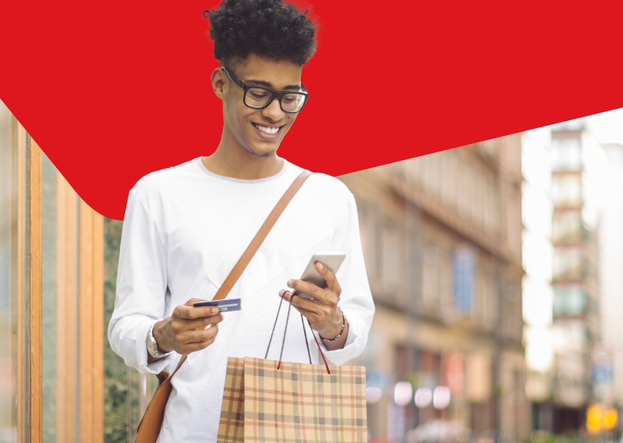 Photo of a person thrilled to be using their National Bank Mastercard credit card 